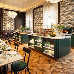 Breakfast restaurant with set up tables and buffet