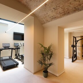 Modern fitness area with weight and cardio training