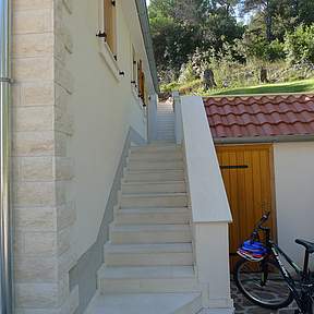 Stairs lead to the main entrance
