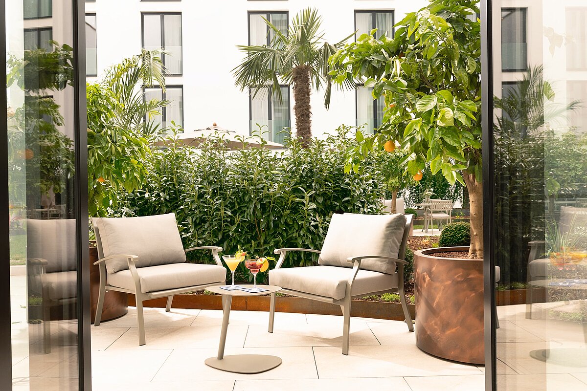 Lounge chairs and table in the hotel garden
