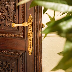 Detail of historic wooden door at the hotel