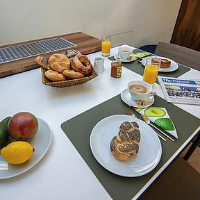 est residences studio apartments dining table with breakfast