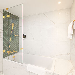 Hotel bathroom with bathtub and shower