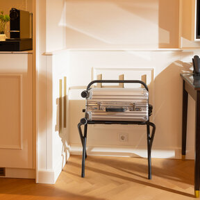 Detail view of hotel room featuring luggage rack