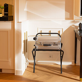 Detail view of hotel room featuring luggage rack